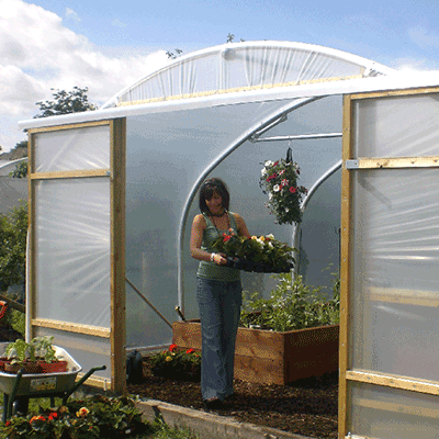 gardener working in a polytunnel adequate polytunnel ventilation