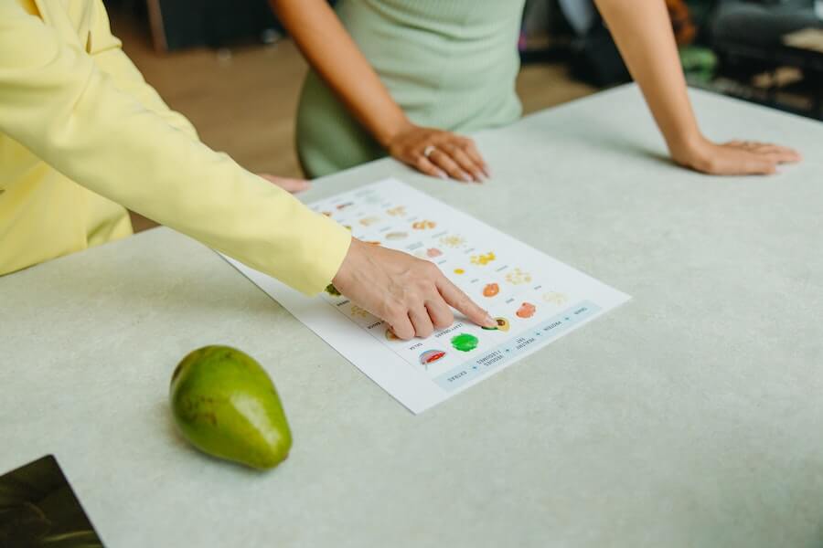 gardeners looking at a list of fruit for sustainable food production