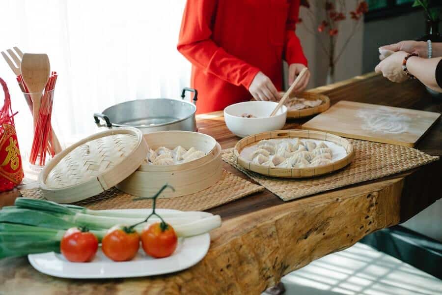 a cook showing what to do with a glut of tomatoes with a steamed bun recipe