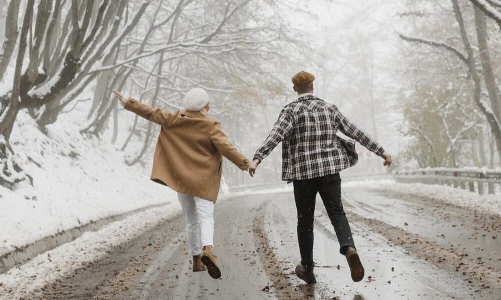 two people walking in the winter