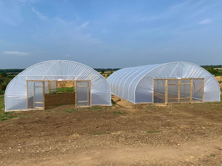 community polytunnel ideas set up in a garden