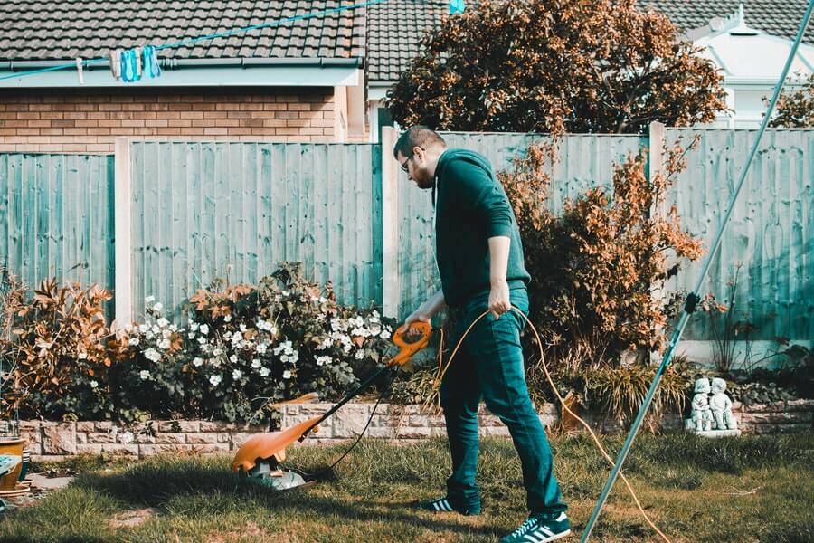 man cutting grass