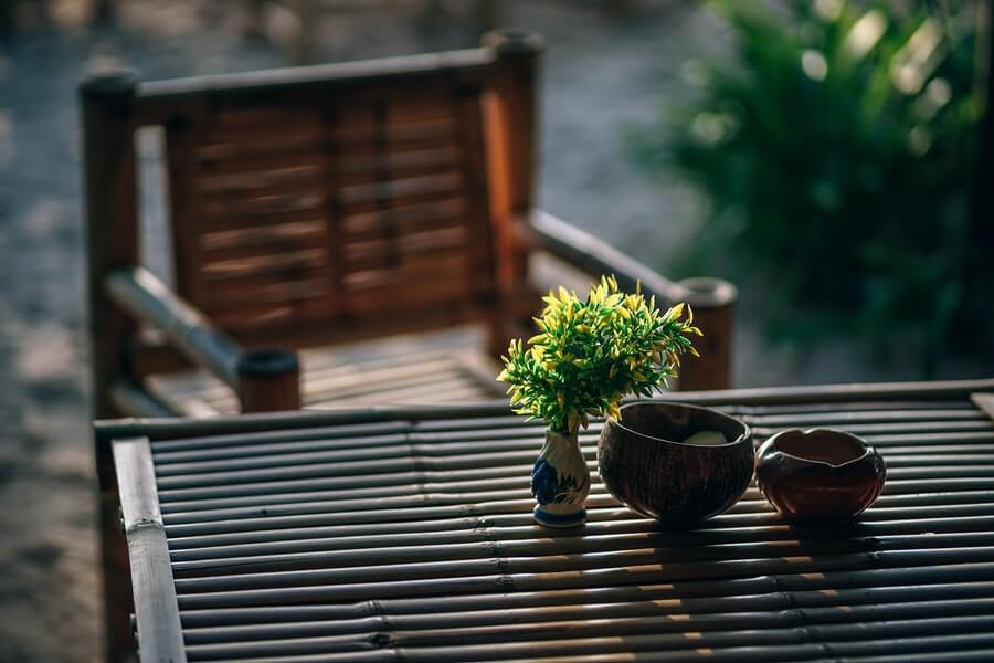 an outdoor dining set in a coastal garden