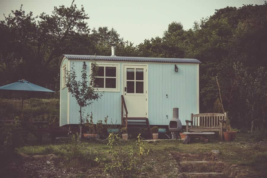 a garden shed used in an edible landscaping design