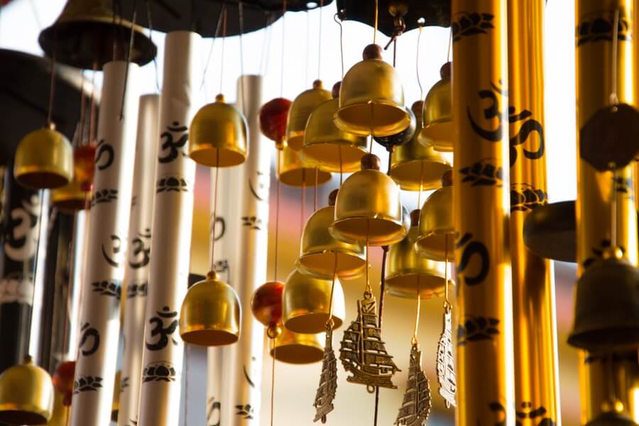 wind chimes on a patio to help windy garden solutions