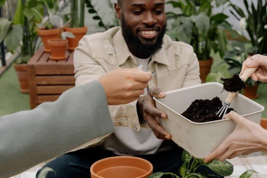 gardeners looking at a small gardening fork