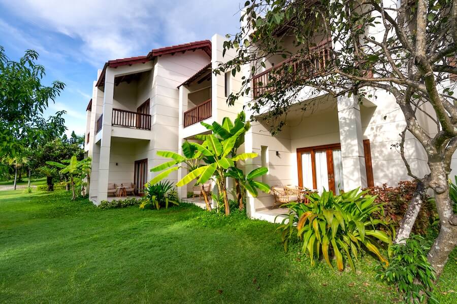 a house with outdoor plants that can be used to cut home bills