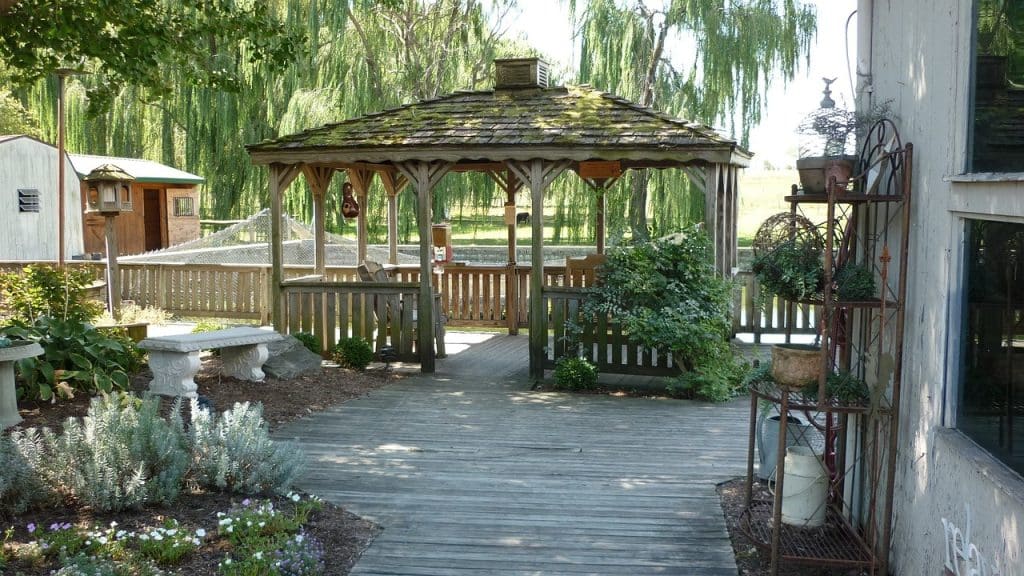a garden patio with a gazebo