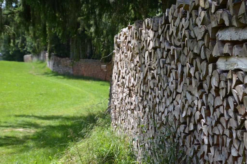 garden wall made with wooden logs