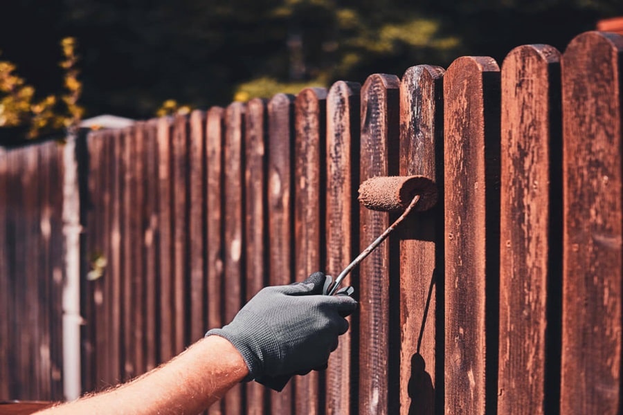 paint a fence on how to make a small garden look bigger